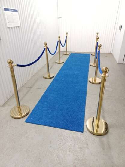 Blue carpet Runner with blue ropes and gold stanchions