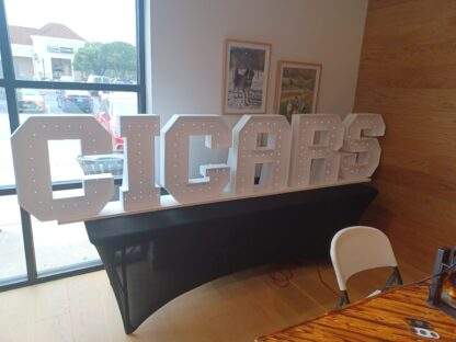 Cigars marquee letters with 8ft table and table cover available to rent