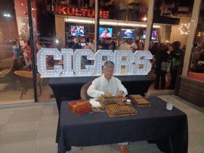 Master roller Bernardo with our CIGARS marquee letters and table